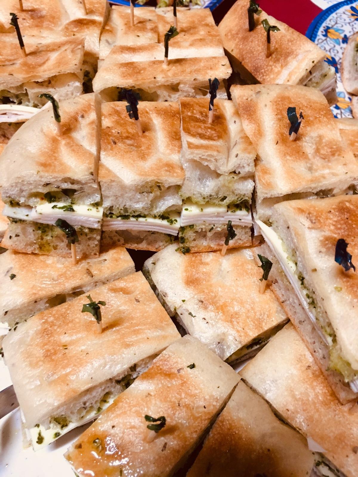Pressed sandwiches with melted cheese, cut and picked.