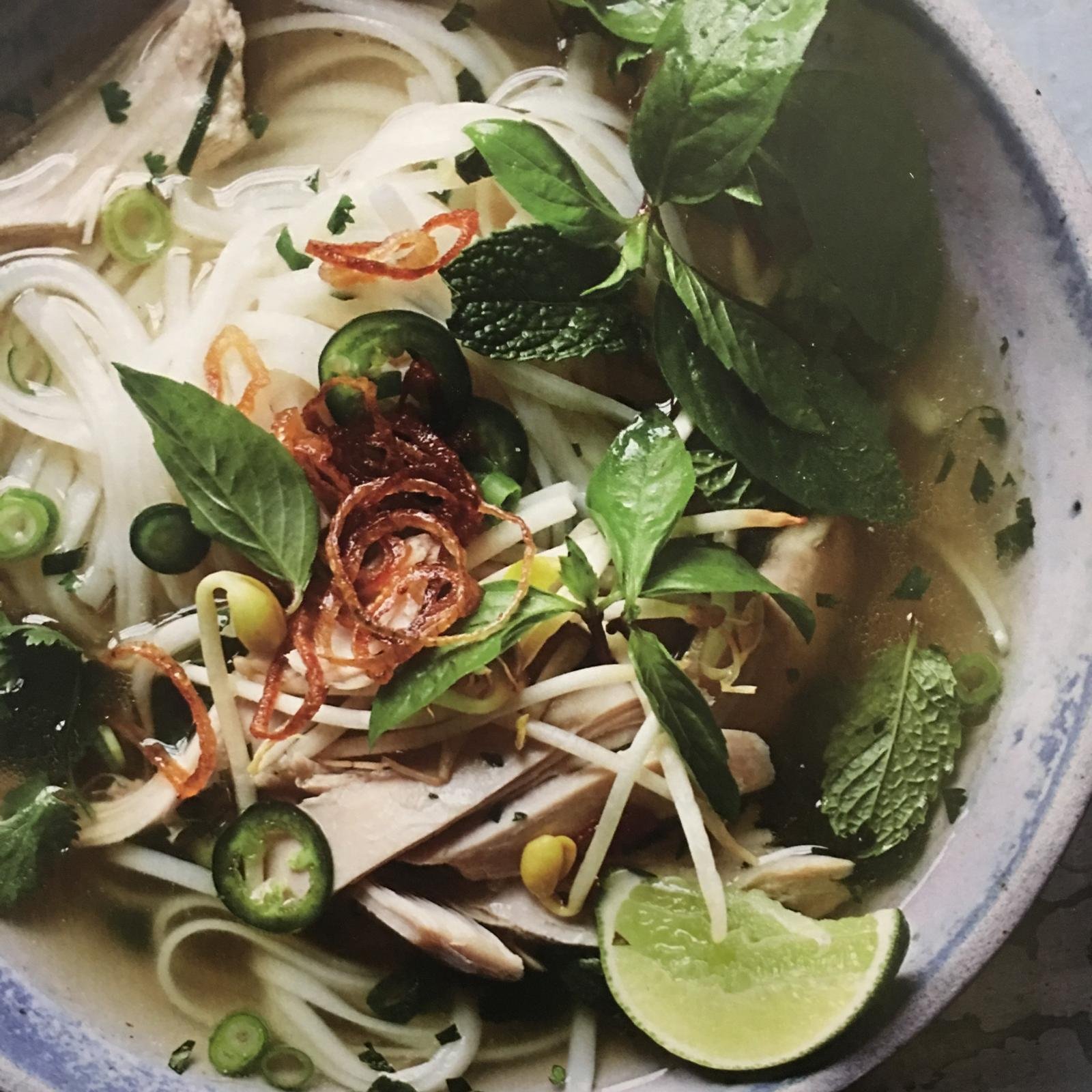 Chicken pho with herbs, chilli and lime.